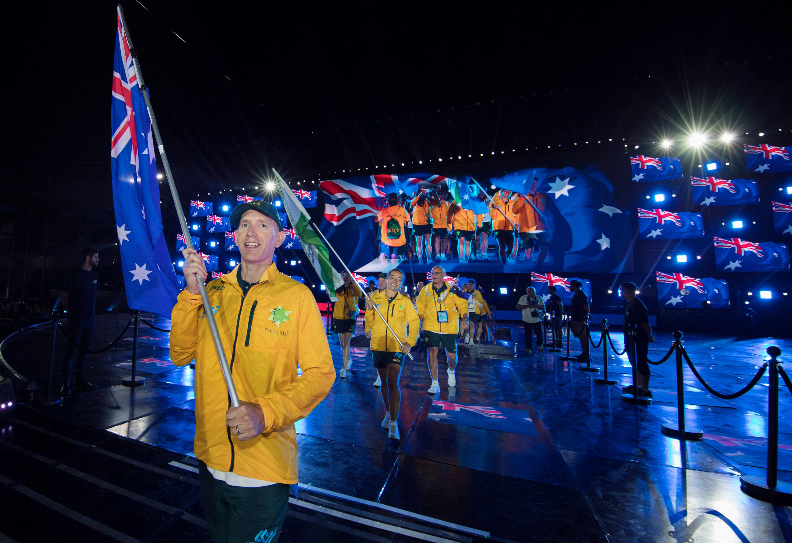 Sean Bloch carries the Australian flag at the 2017 Maccabiah Games opening ceremony. Photo: Julie Kerbel