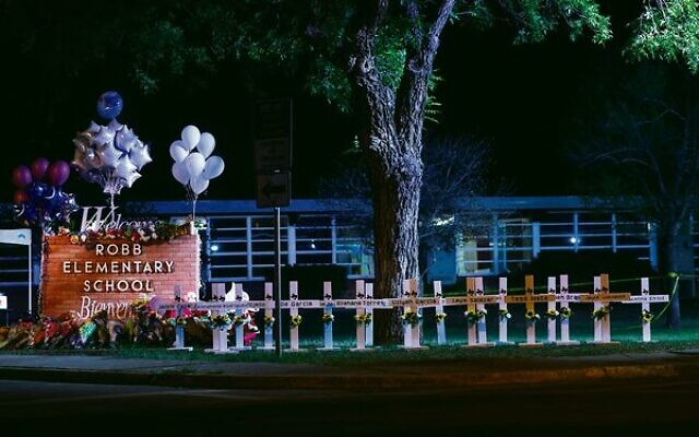 Crosses outside of Robb Elementary School in Uvalde, Texas, after a gunman killed 21 people. 
Photo: Yasin Ozturk/Anadolu Agency via Getty Images