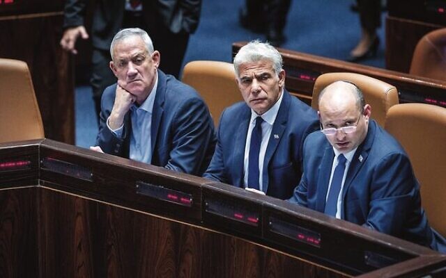 From left: Defence Minister Benny Gantz, Foreign Minister Yair Lapid and Prime Minister Naftali Bennett during a discussion and a vote on the vote on the "settler law bill" at the Knesset.Photo: Yonatan Sindel/Flash90