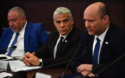 Naftali Bennett, right, sitting alongside Yair Lapid, centre, and Finance Minister Avigdor Lieberman, leads a cabinet meeting at the Prime Minister's Office in Jerusalem on June 26.
Photo: Yoav Dudkevitch