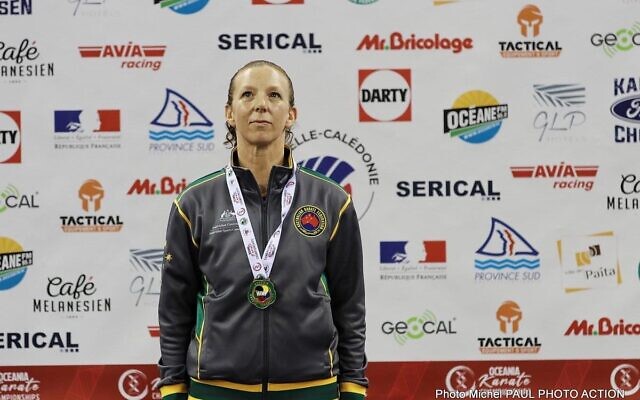 Kerry Saloner wearing her gold medal at the 2022 Oceania Karate Championships.