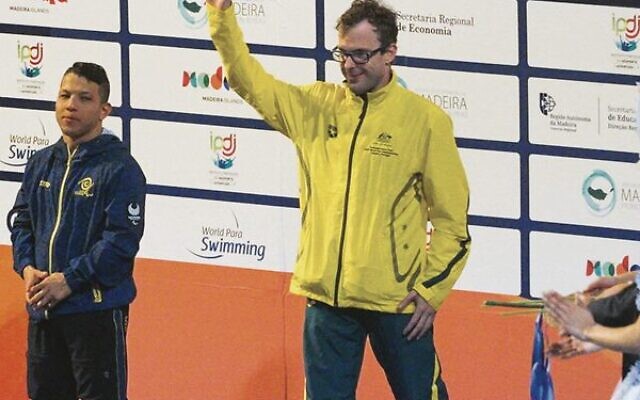 Matt Levy receiving his breaststroke bronze medal at the 2022 World Para Swimming Championships. He also won gold as part of Australia's 4x100 mixed medley team.
