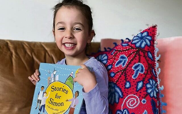 Selah Gregor receiving her Stories for Simon book.