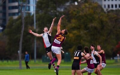 Toby Lipton leaps high for the Jackas at the opening bounce. Photo: Peter Haskin
