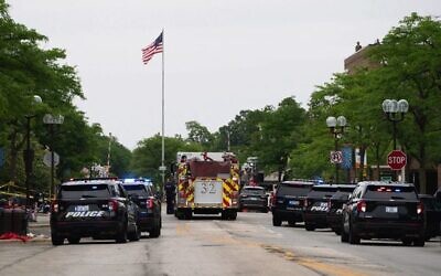 First responders and the police force are seen at the scene of the shooting at a July 4 parade in Highland Park. Photo: Youngrae Kim/AFP via Getty Images