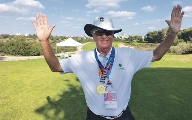 Roy Vandersluis proudly wearing his gold medal as grandmasters golf champion. Photo: Shane Desiatnik