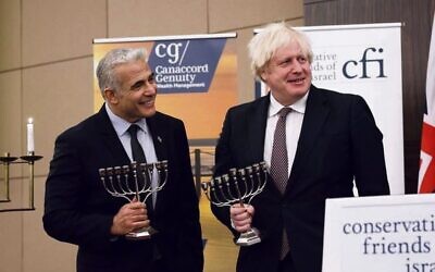 Yair Lapid (left) and Boris Johnson at a Conservative Friends of Israel event in London last year. Photo: Stuart Mitchell