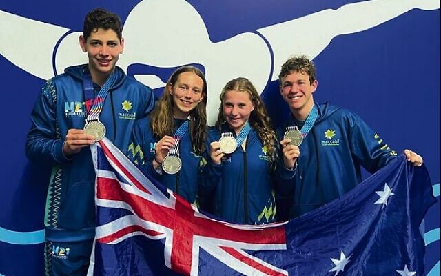 Australia's junior 4x100 mixed medley relay team with their silver medals.