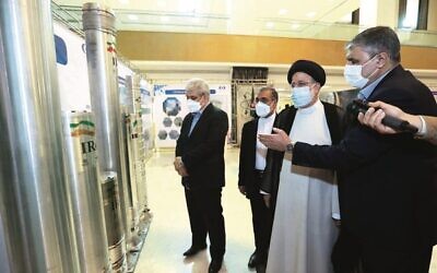 Iran's President Ebrahim Raisi (second from right) views an advanced centrifuge at an exhibition of Iran's nuclear achievements in April. Photo: Iran President's Office