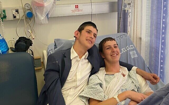 Elazar, 19, (right) and Dovi, 16, (left) are seen at the Hadassah Mount Scopus hospital, after the pair were wounded in a shooting attack in Jerusalem, August 14, 2022.