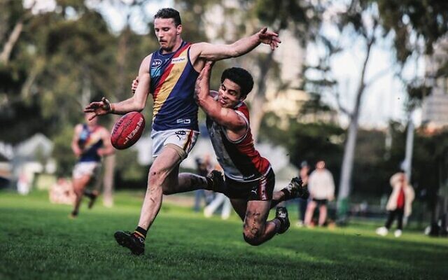 This desperate tackle by AJAX captain Nick Lewis prevented a St Bedes-Mentone Tigers player from scoring a winning goal in both teams' last match of the VAFA Premier B men's season last Saturday at Gary Smorgon Oval. The match ended in a draw. Photo: Jack Dilks