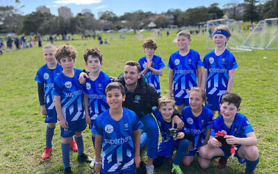 The Maccabi-Hakoah U9 Hawks Miniroos team, with their coach Ashe Ure, last weekend. They finished their season with a 1-0 win.