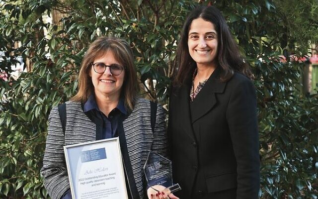 Masada principal Mira Hasofer (left) congratulates Adi Halevi on her award.