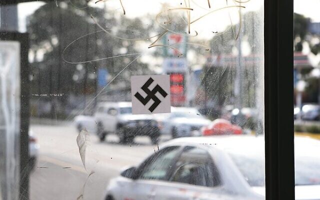 A swastika on a tram stop on Hawthorn Road in Caulfield. Photo: Peter Haskin