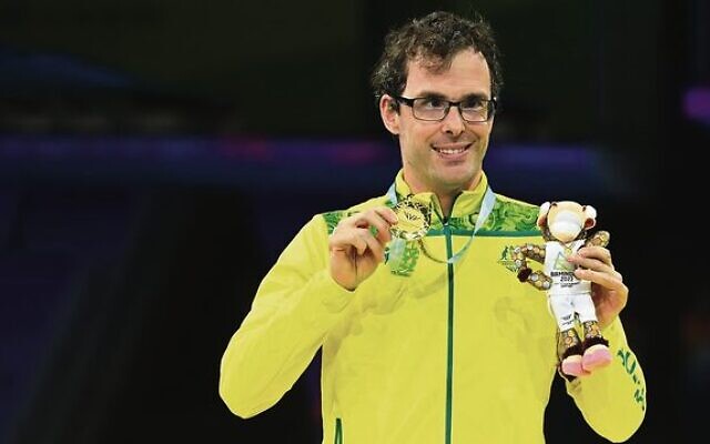 Matt Levy with his gold medal and Birmingham Commonwealth Games mascot, Perry.  Photo: Supplied
