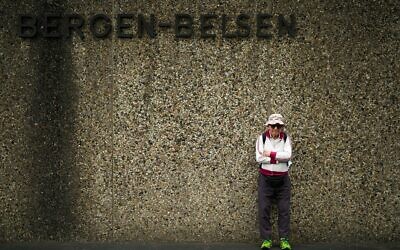 Israeli Olympic race walker Shaul Ladany poses for a photo at the entrance of the Nazi concentration camp Bergen-Belsen. Photo: AP Photo/Markus Schreiber