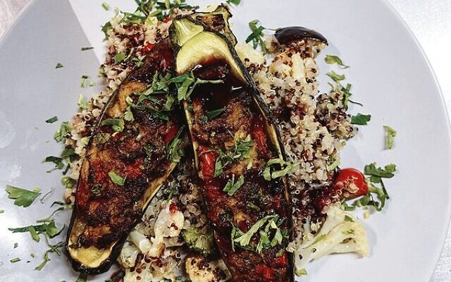 Spiced stuffed zucchini, topped with pomegranate molasses.