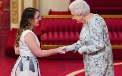 Madeleine Buchner receives her Queen's Young Leaders award in 2017 from Her Majesty the Queen at Buckingham Palace.