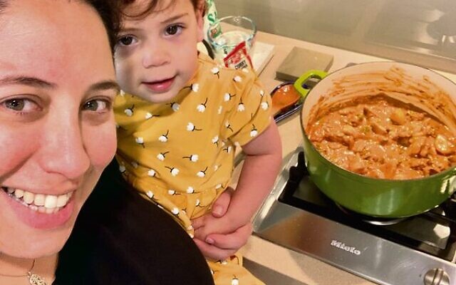 Jessica, with her niece Poppie, teaching the next generation how to make chicken curry.
