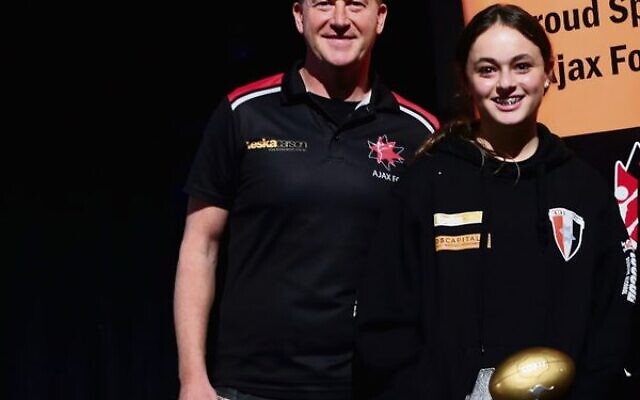 AJAX Junior Footy Club president Jamie Davis with 2022 Female Club Champion Tahlia Herman.