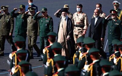 Supreme Leader Ayatollah Ali Khamenei (centre) reviewing a group of armed forces cadets during their graduation ceremony in Tehran, Iran, October 3, 2022. 
Photo: Office of the Iranian Supreme Leader via AP