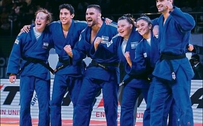 The Israeli mixed Judo team celebrates after winning bronze at the 2022 Judo World Championships in Tashkent last week. Photo: International Judo Federation