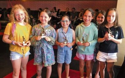 Some of the junior team award winners with their trophies.