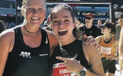 Jemima Montag (right) at the Melbourne Marathon finish line last Sunday with Ultra Trail runner Lucy Bartholomew.