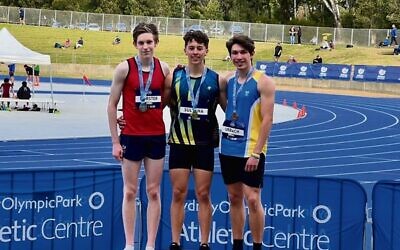 Zach Urbach (right) on the podium at the 2022 NSW All Schools Athletics Championships.