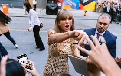 Taylor Swift greets fans before a conversation at the 2022 Toronto International Film Festival. Photo: Wesley Lapointe/Los Angeles Times, Getty Images via JTA