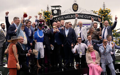 Members of Gold Trip's ownership group celebrating with jockey Mark Zahra. Sonney Roth is in the back row, fourth from the right. Photo: Screenshot from footage by Victoria Racing Club