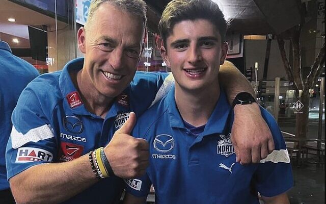 New Kangaroos coach Alistair Clarkson (left) with the club's number 3 AFL draft pick Harry Sheezel. 
Photo: North Melbourne Kangaroos