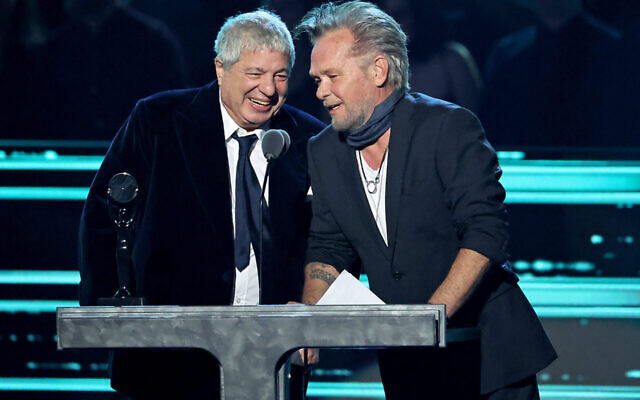 Allen Grubman and John Mellencamp onstage during the 37th Annual Rock & Roll Hall of Fame Induction Ceremony. Photo: Amy Sussman/WireImage