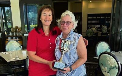 Winning NSW Queens Cup captain Jody Drutman (left) with Victorian captain Wendy Beron.