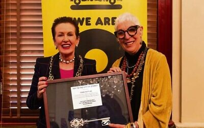 Lord Mayor Clover Moore (left) presents a key to Ronni Kahn.