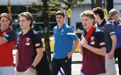 Harry Sheezel (centre) walking among his fellow draft picks the morning after the draft. Photo: Peter Haskin.