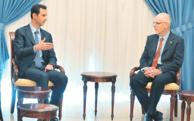 Tim Anderson with Bashar al-Assad in 2013. Photo: AP Photo/SANA