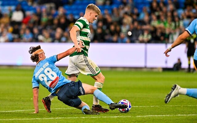 Sydney FC's Jake Girdwood-Reich challenges Celtic FC player Scott Robertson for the ball during the match on November 17 at Allianz Stadium. Photo: Keith McInnes