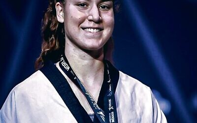 Dana Azran wearing her 2022 Taekwondo World Championships silver medal.