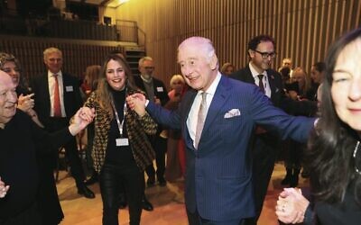Britain's King Charles III dances during a visit to the JW3 Jewish community centre in London ahead of Chanukah. Photo: Ian Vogler/Pool via AP