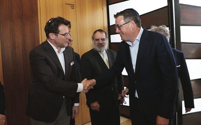 Visiting Central Shule, Premier Daniel Andrews (right) meets JCCV president Daniel Aghion (left) as Rabbi Yitzhok Riesenberg looks on. Photo: Peter Haskin