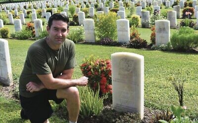 Josh Burns paying tribute to Jewish-Australian Private J.Rovkin at Bomona War Cemetery.
