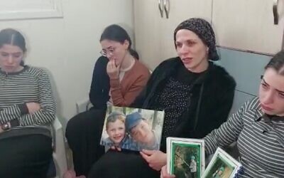 Devora Paley holds a picture of her sons Yaakov Yisrael and Asher Menahem, who were killed in a terror attack in Jerusalem, as she speaks to reporters while marking the traditional Jewish mourning period. Photo: Twitter screenshot.