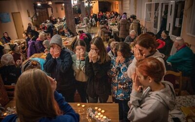 Ukrainian refugees light Shabbat candles at a Kedem JCC call centre and refugee shelter in Kishinev, Moldova. Photo: Arik Shraga