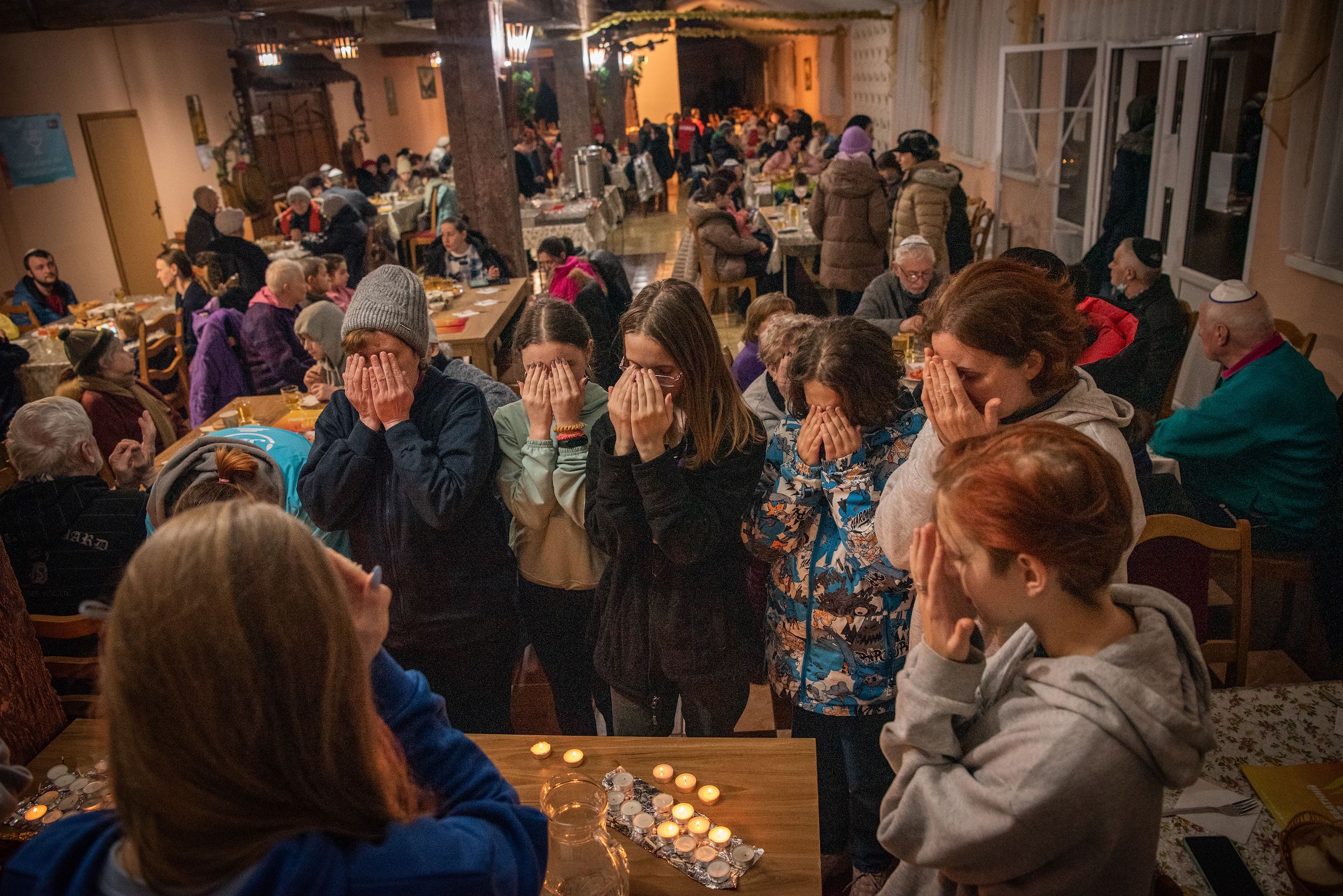 Ukrainian refugees light Shabbat candles at a Kedem JCC call centre and refugee shelter in Kishinev, Moldova. Photo: Arik Shraga