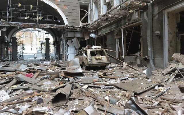 Damage in a building entrance after the shelling by Russian forces of Constitution Square in Kharkiv. Photo: by Sergey BOBOK/AFP