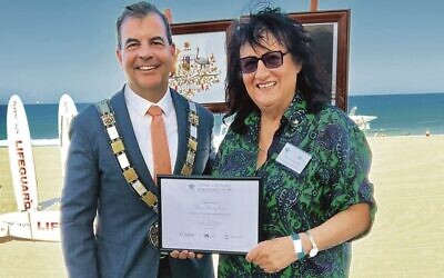 Mayor of Stirling Mark Irwin presenting Menora co-founder and vice-president Vivienne Bensky with a certificate of appreciation on Australia Day.