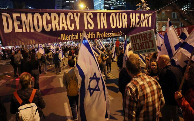 Demonstrators attend a protest against the Israeli government's controversial judicial reform bill in Tel Aviv on March 11, 2023. (Photo by JACK GUEZ / AFP)