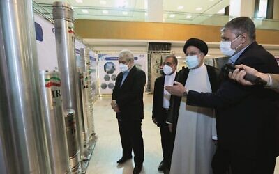 Iran's President Ebrahim Raisi (second from right) views an advanced centrifuge in Tehran in April 2022. Photo: Iran President's Office