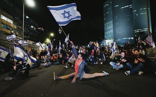 Demonstrators block a highway during protests in Tel Aviv on Saturday night. 
Photo: AP Photo/Ohad Zwigenberg